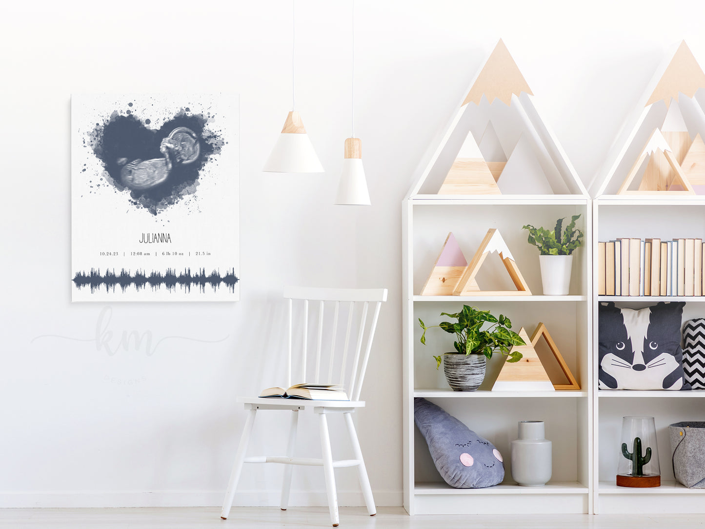 Ultrasound and heartbeat keepsake displayed in nursery with personalization options