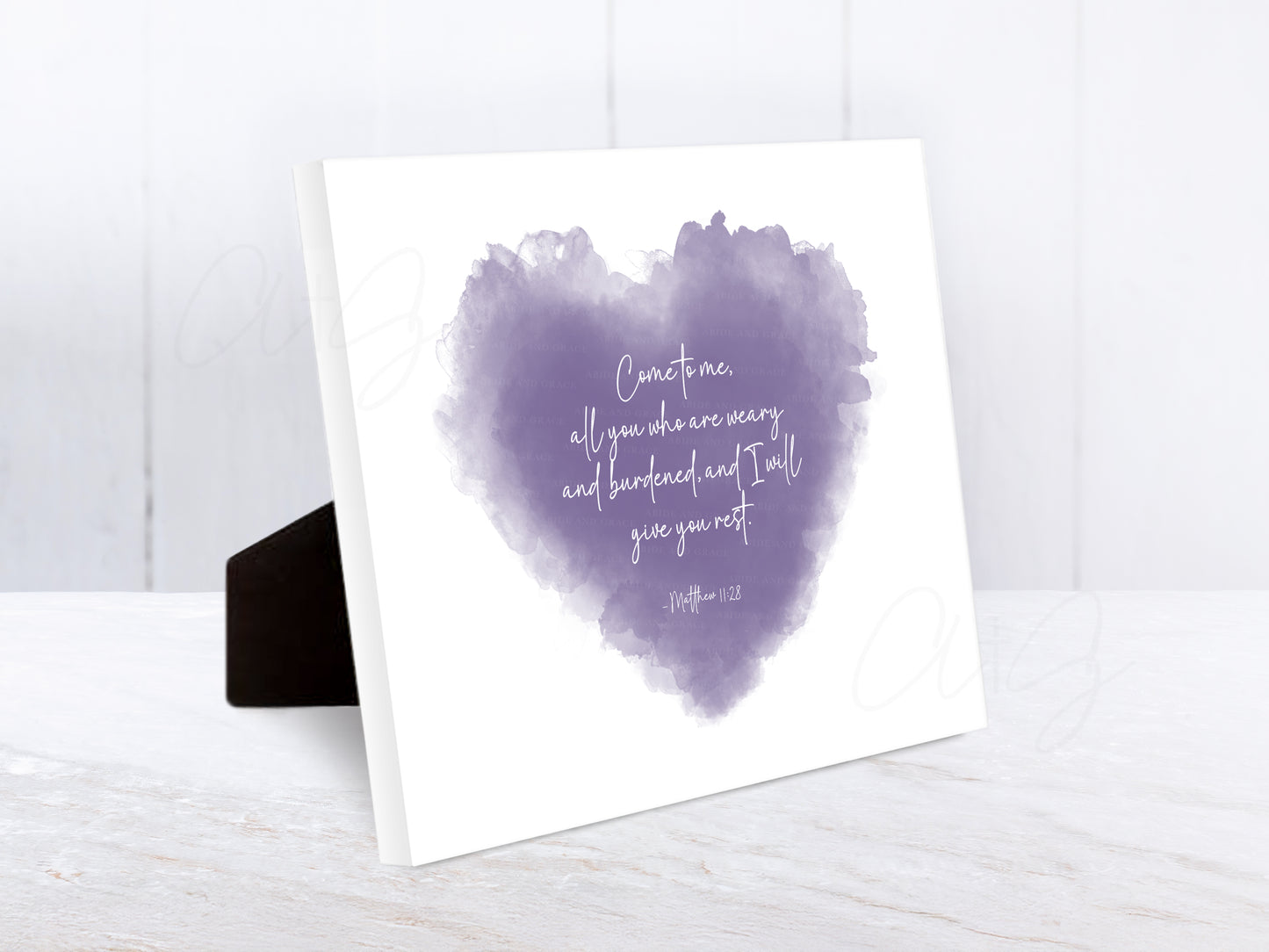 Encouraging Bible verse artwork in a watercolor heart design featuring Matthew 11:28 — “Come to me, all you who are weary and burdened, and I will give you rest.”