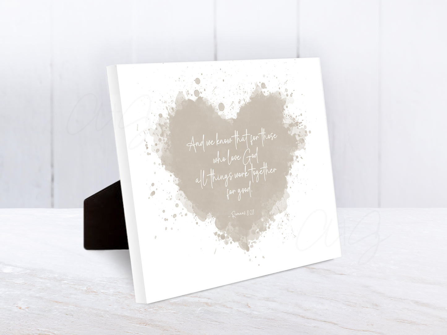 Heart-shaped Bible verse artwork featuring Romans 8:28 for Christian home or nursery
