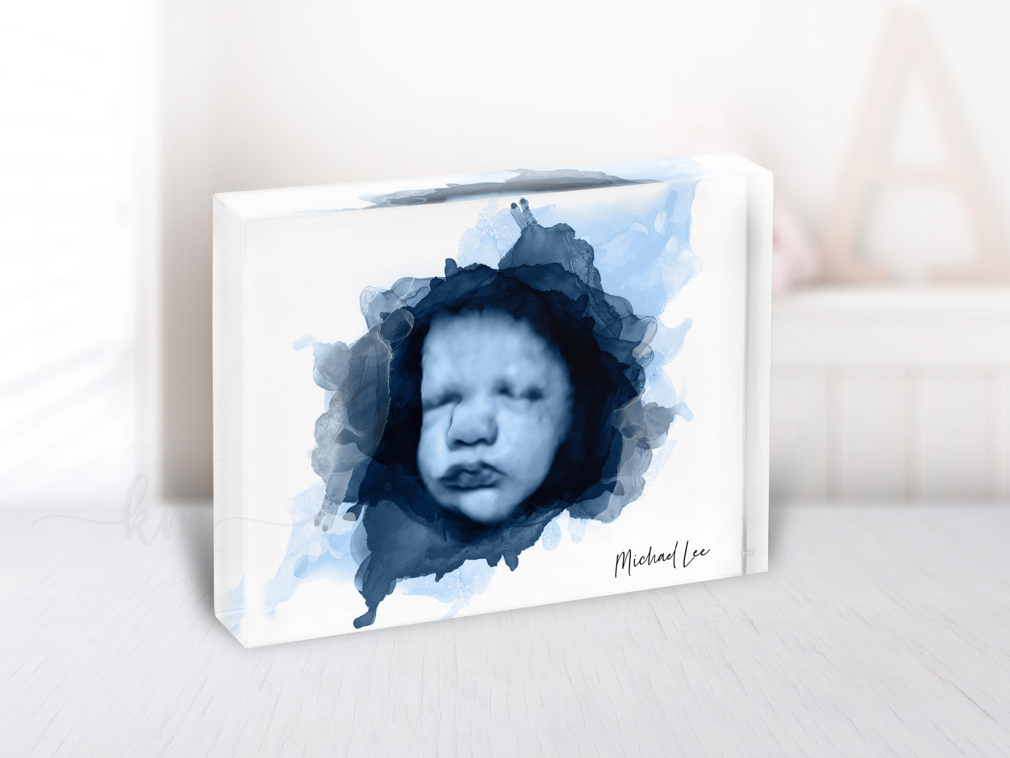 Watercolor baby memorial artwork in alcohol ink design, displayed in modern nursery setting

